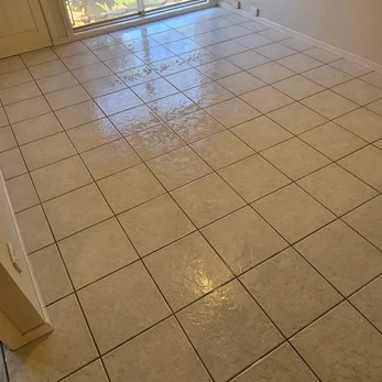 Cream floor tiles with clean grout lines